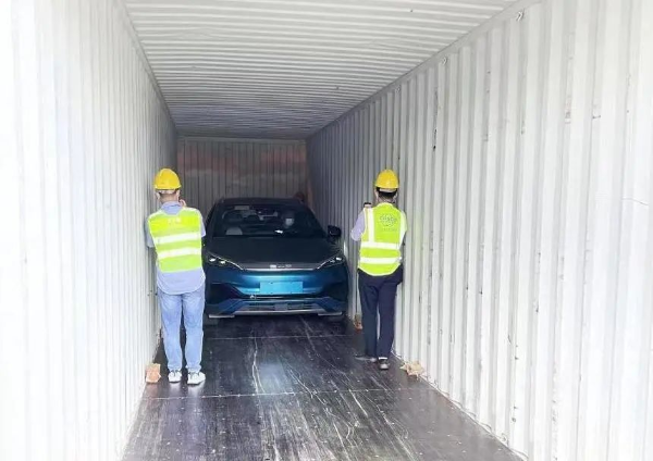 Image of cars being loaded into a container